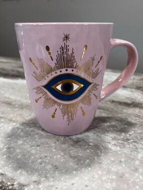 Pink Ceramic Mug with Blue and Gold Eye Motif